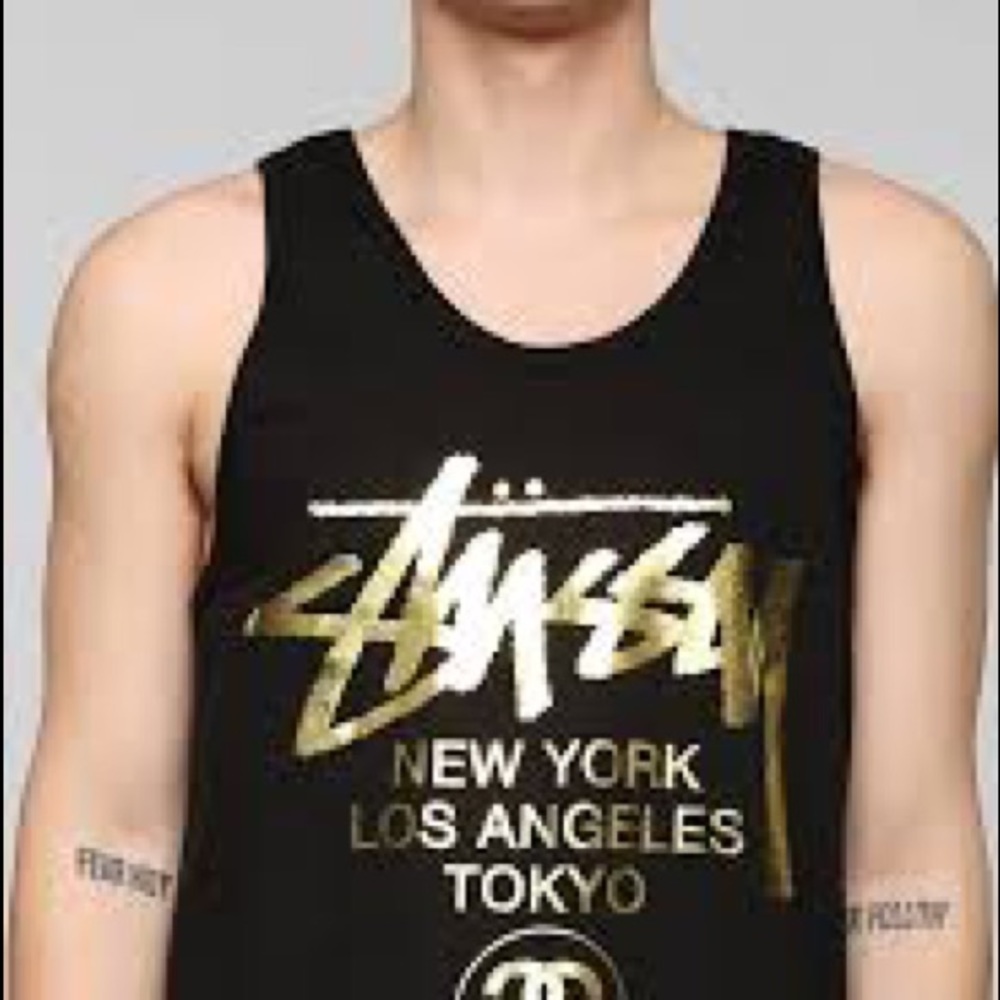 Stussy Men’s gold-printed tank. Size M.